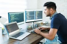 A programmer programming on his laptop.jpg